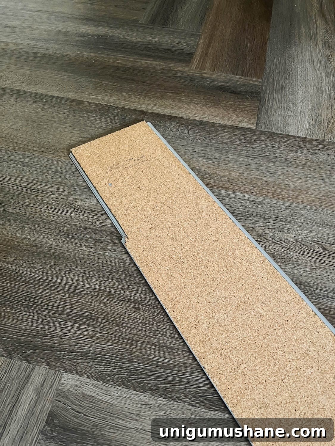 cork LVP underlayment in herringbone pattern