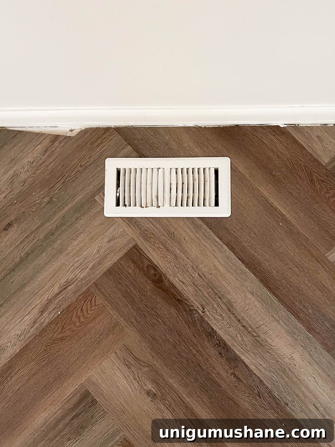 Transform Corner Banquette and Redirect Under Cabinet Air Vents 5 floor vent against a wall on herringbone flooring