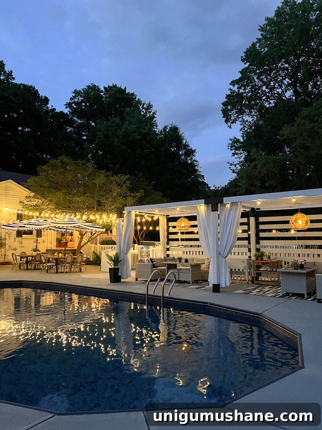 Backyard Lighting Ideas You Can Install Yourself 2 backyard pool with pergola cabana, outdoor curtains, and backyard lighting