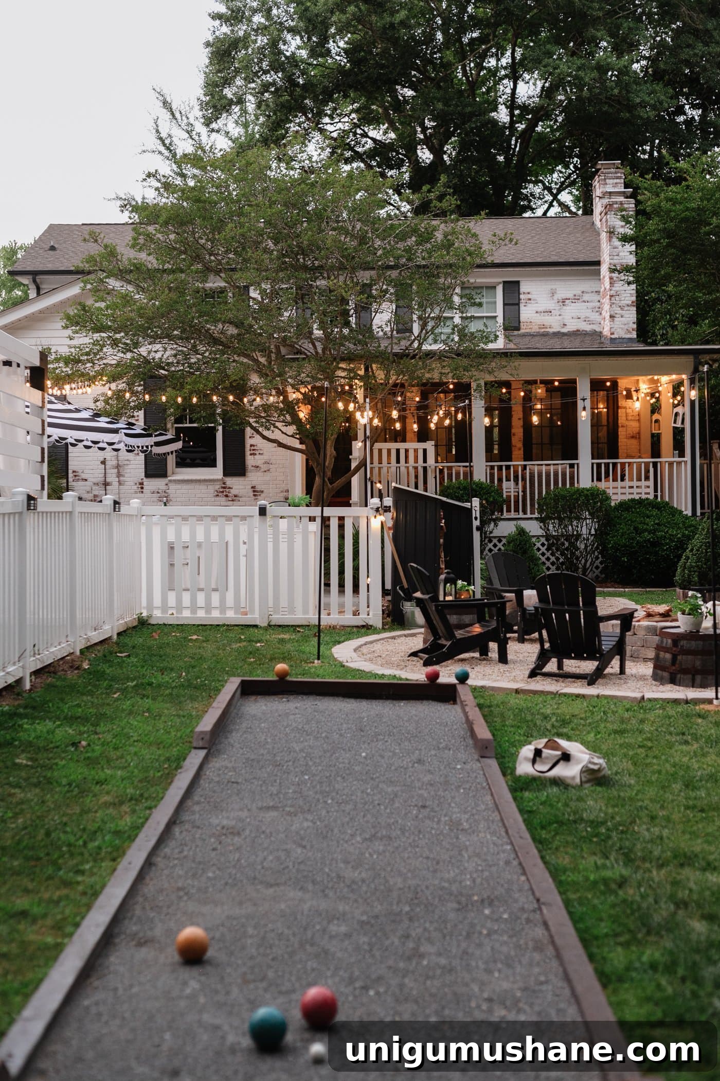 Backyard Lighting Ideas You Can Install Yourself 4 backyard lighting ideas with string lights and lanterns including a bocce ball court and a fire pit