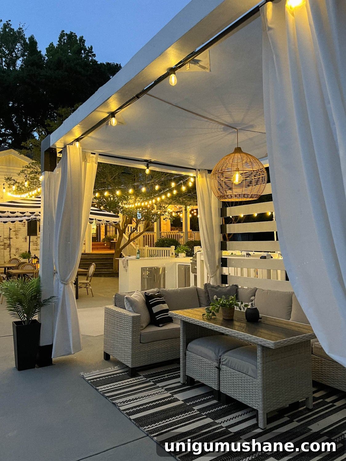 Backyard Lighting Ideas You Can Install Yourself 5 a backyard pool cabana with string lights and a solar pendant light above patio furniture