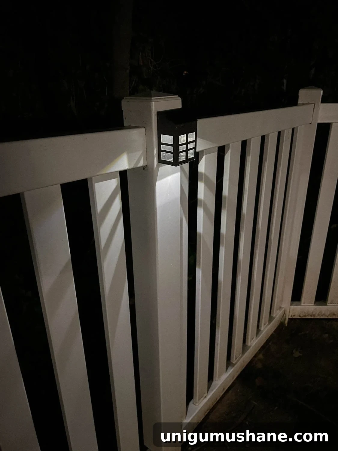 Backyard Lighting Ideas You Can Install Yourself 10 a solar step light attached to a fence post lit up at night