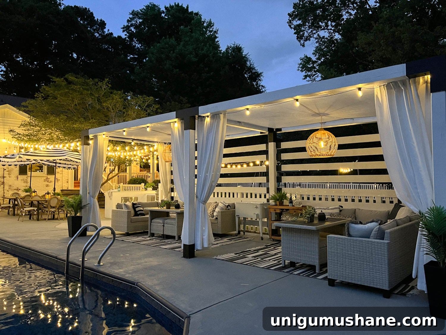 How to Hang Outdoor String Lights Anywhere in Your Backyard 3 backyard string lights around a pool and pergola
