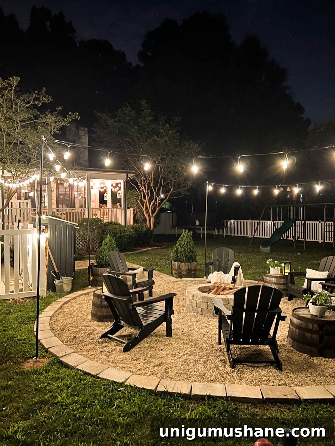 How to Hang Outdoor String Lights Anywhere in Your Backyard 23 fire pit at night time with string lights in a backyard