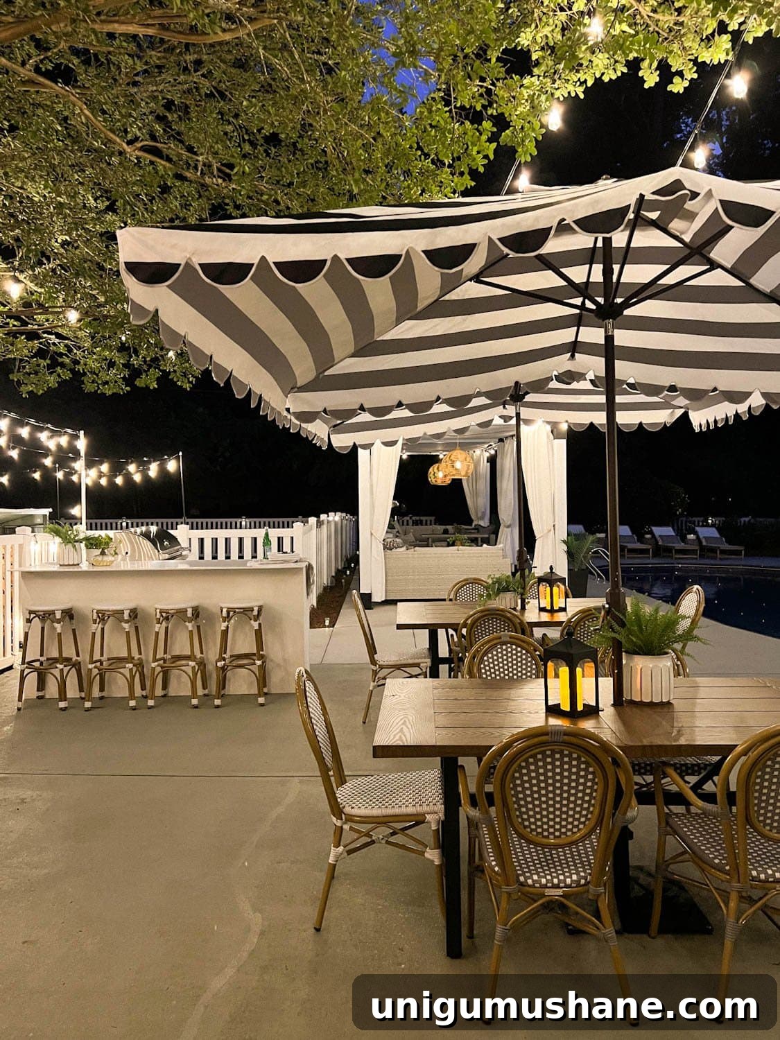 How to Hang Outdoor String Lights Anywhere in Your Backyard 24 outdoor dining tables and outdoor kitchen with string lights overhead