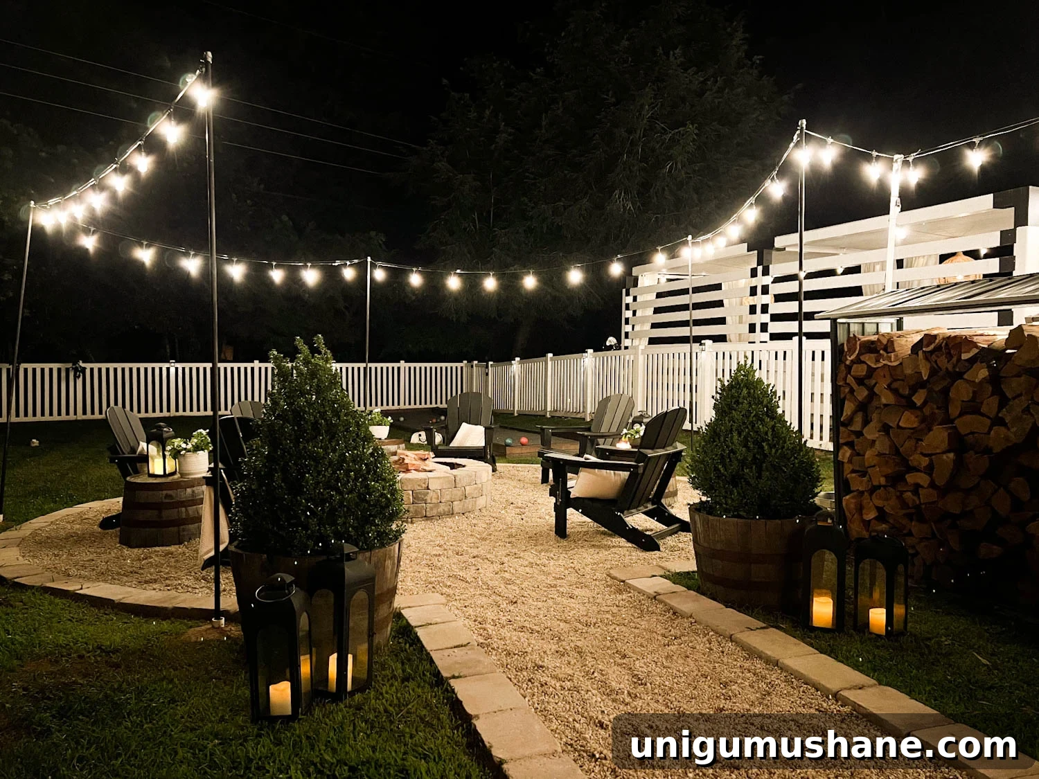 How to Hang Outdoor String Lights Anywhere in Your Backyard 5 outdoor string lights around a fire pit in a backyard