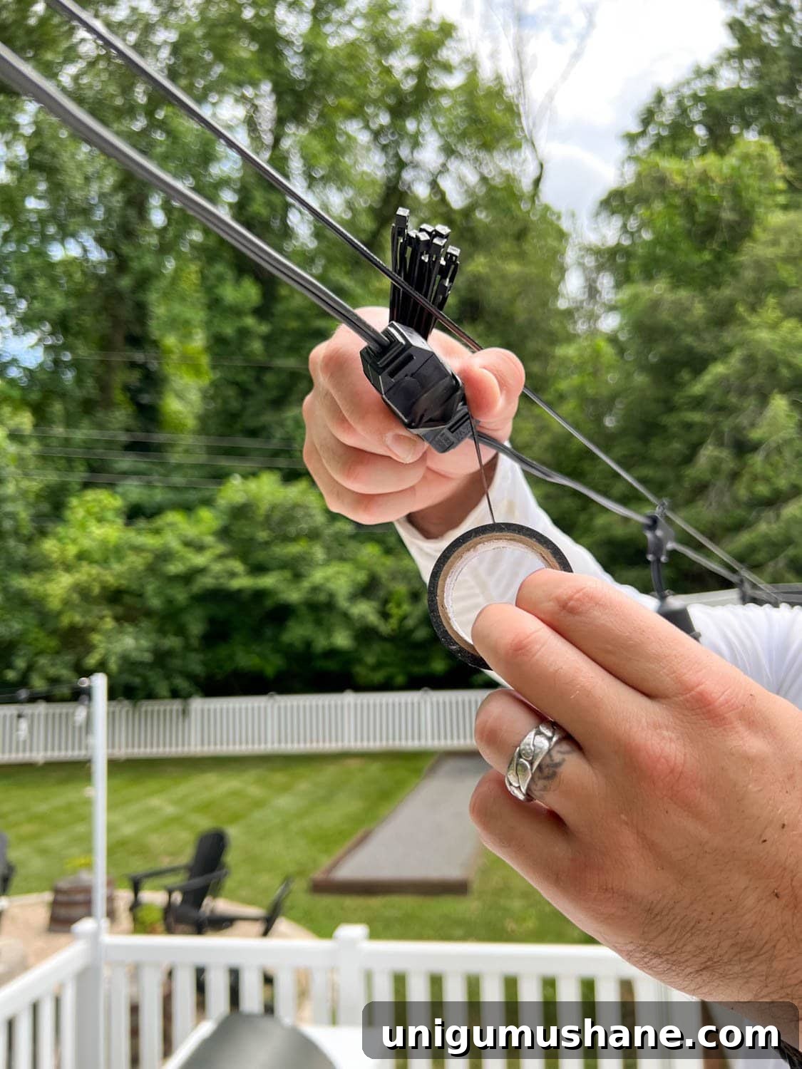 How to Hang Outdoor String Lights Anywhere in Your Backyard 32 wrapping light plugs with black electrical tape