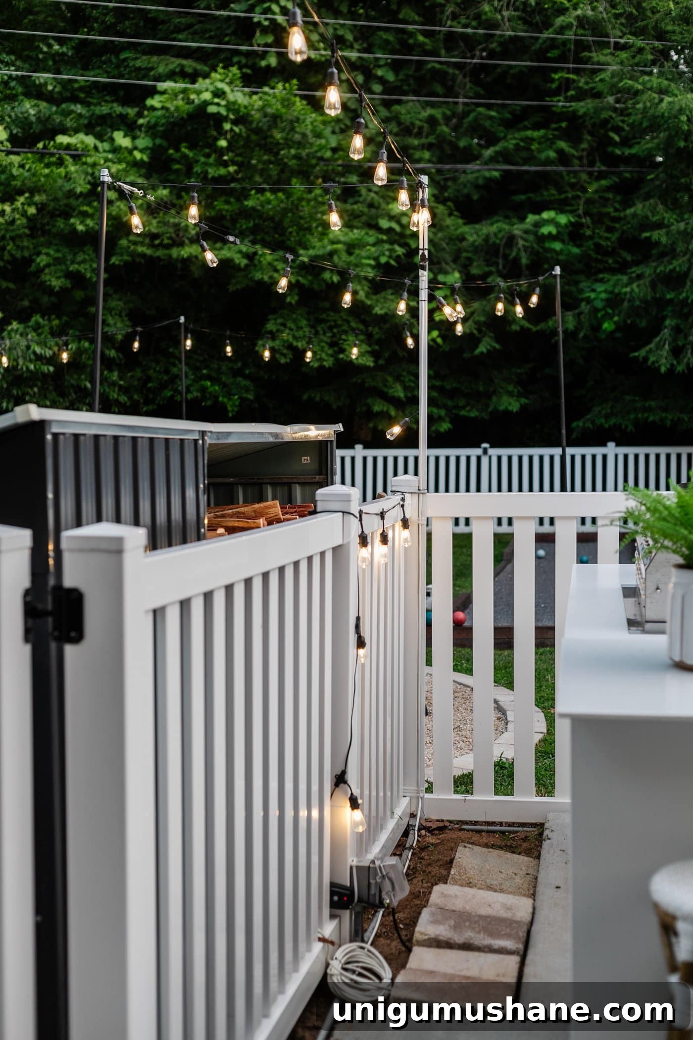 How to Hang Outdoor String Lights Anywhere in Your Backyard 7 plug in outdoor lights with an outlet, outdoor extension cord, and outdoor timer