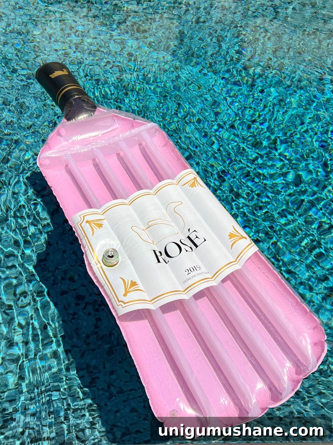 Must-Have Pool Toys for Kids and Adults This Summer 18 wine bottle shaped pool float in the water