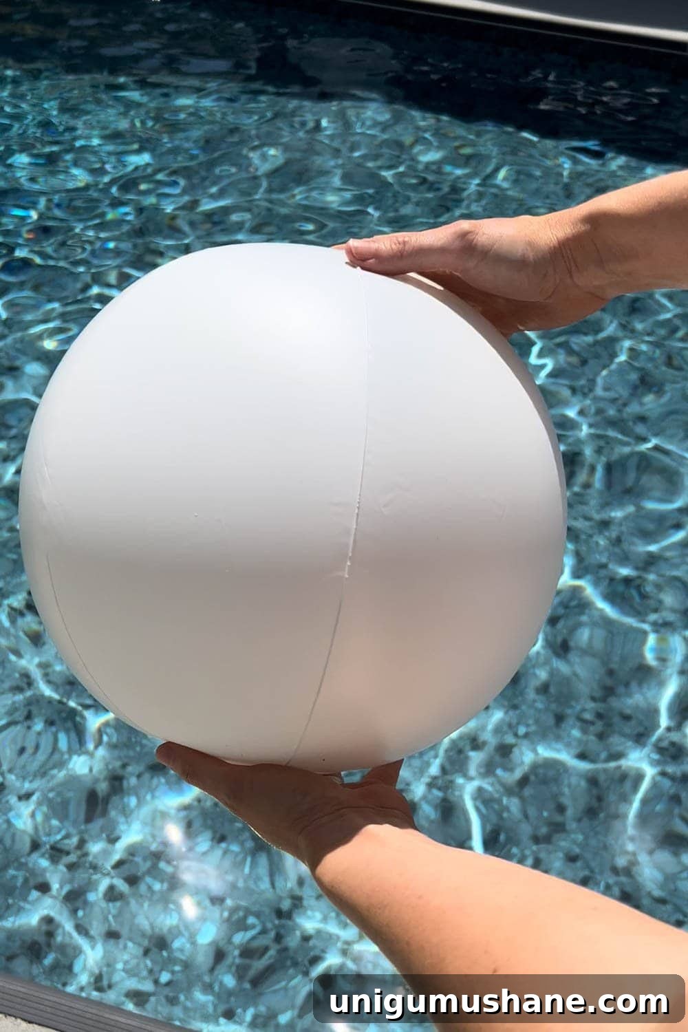 Must-Have Pool Toys for Kids and Adults This Summer 4 white beach ball over water