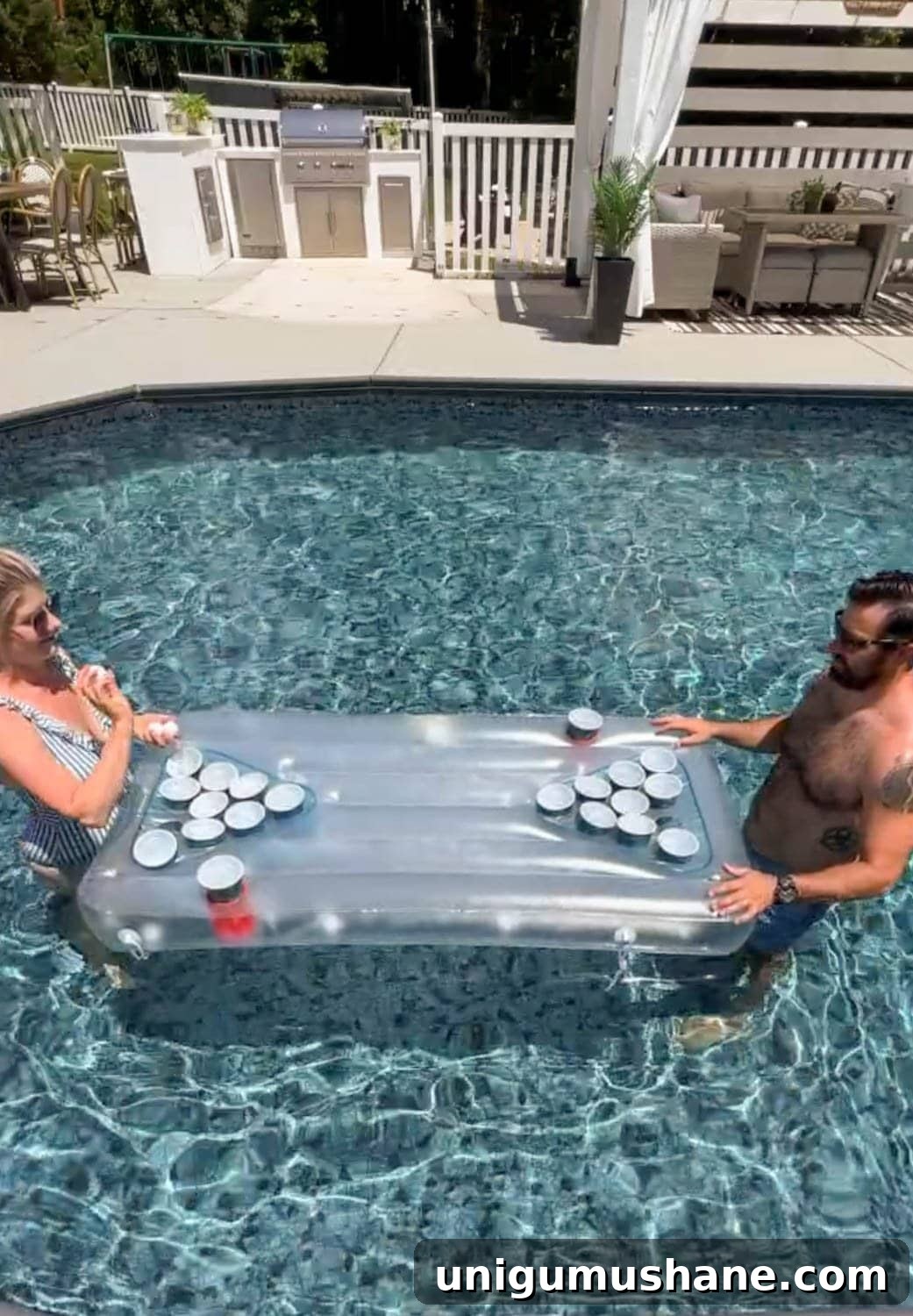 Must-Have Pool Toys for Kids and Adults This Summer 6 couple playing a beer pong game on a light up pool float