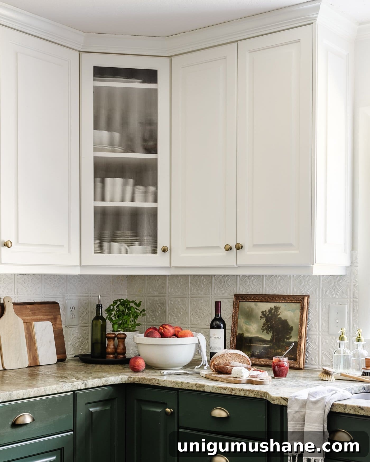 Decorative Window Film Ideas to Transform Home Glass on a Budget 2 reeded glass cabinet door using decorative window film in a kitchen with bowl of peaches, tray, and vintage art