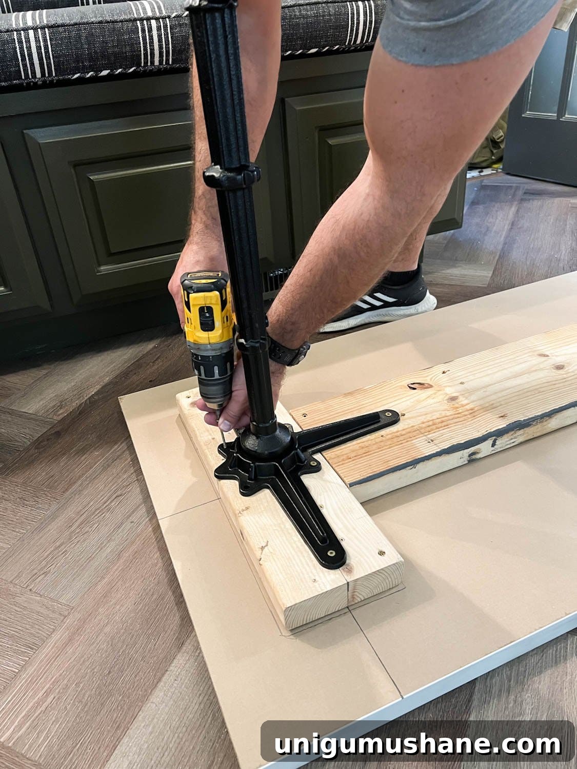 screwing cast iron pedestal table legs into a table top