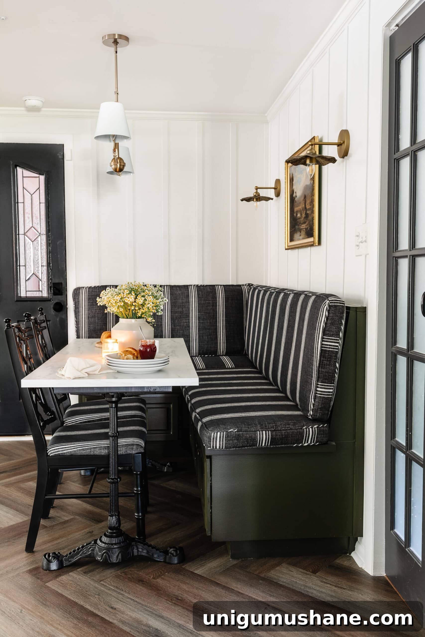 Parisian Bistro-Inspired Breakfast Nook Decor Ideas 2 Parisian bistro style breakfast nook decor with banquette bench, marble and cast iron table, and chinoiserie bamboo dining chairs