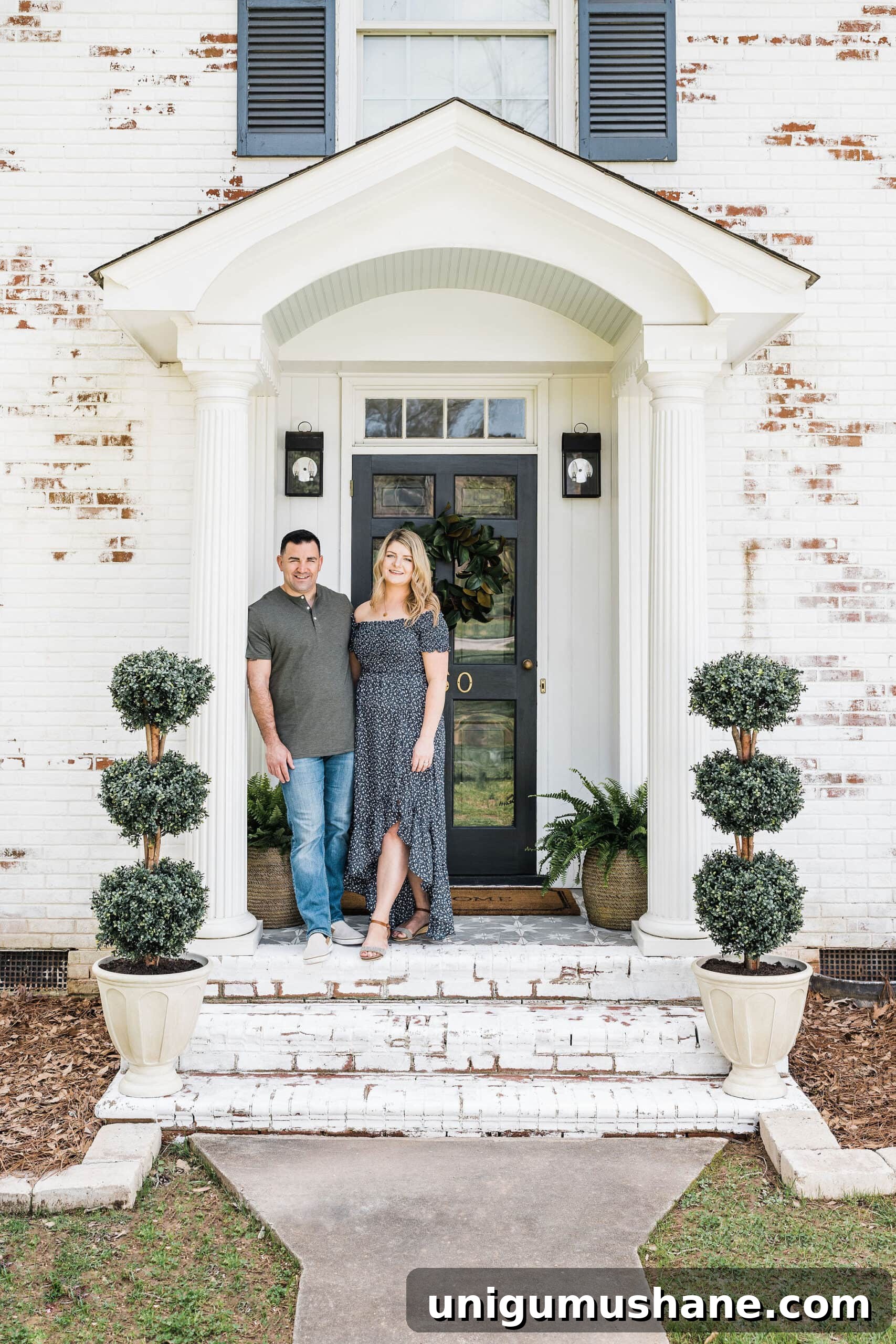5-Year Home Transformation: Before and After Tour 2 limewashed brick front porch stoop on a colonial house with boxwood topiaries