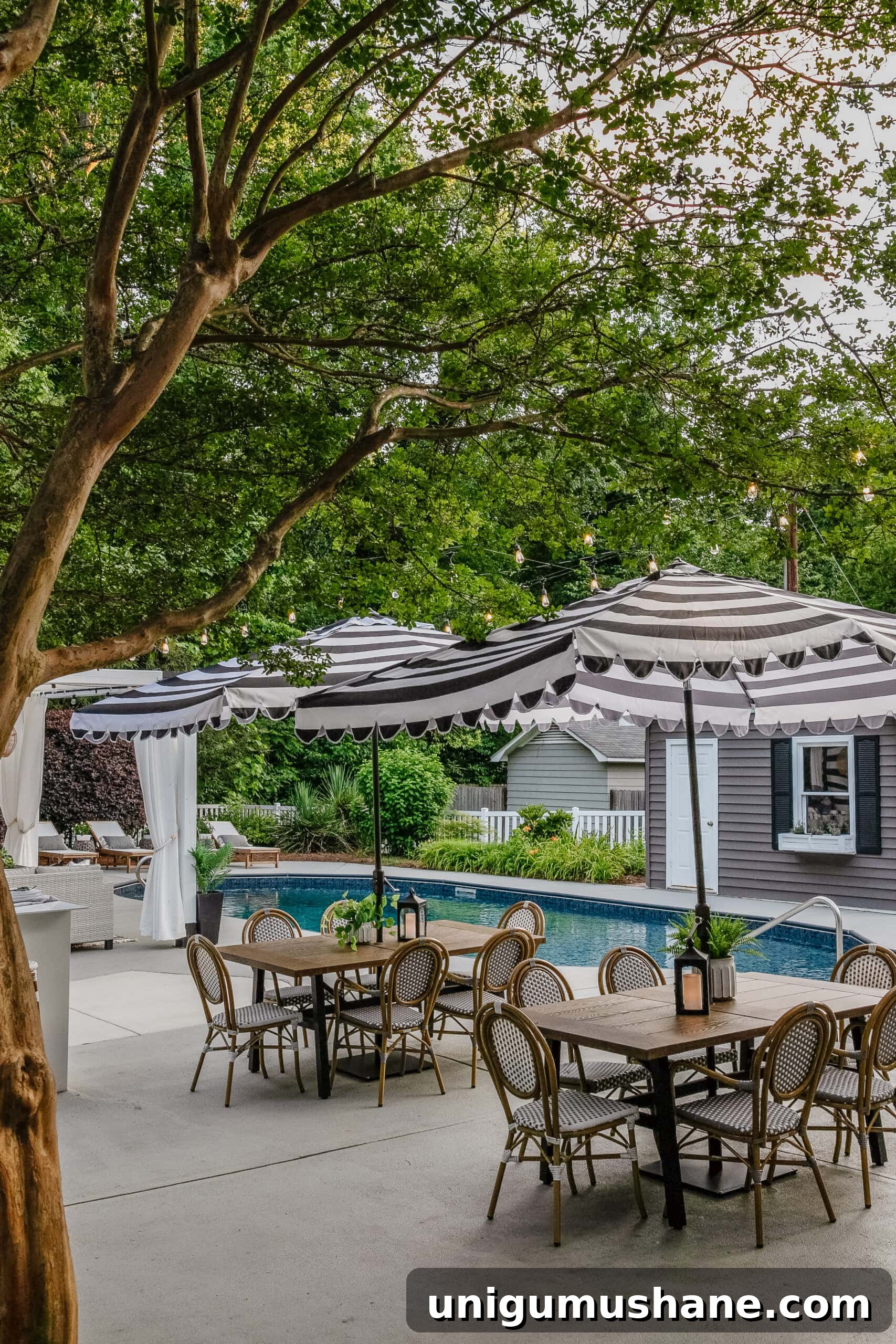 5-Year Home Transformation: Before and After Tour 48 backyard swimming pool with outdoor dining sets, striped umbrella, painted vinyl siding on shed, painted concrete deck, poolside patio furniture and cabana