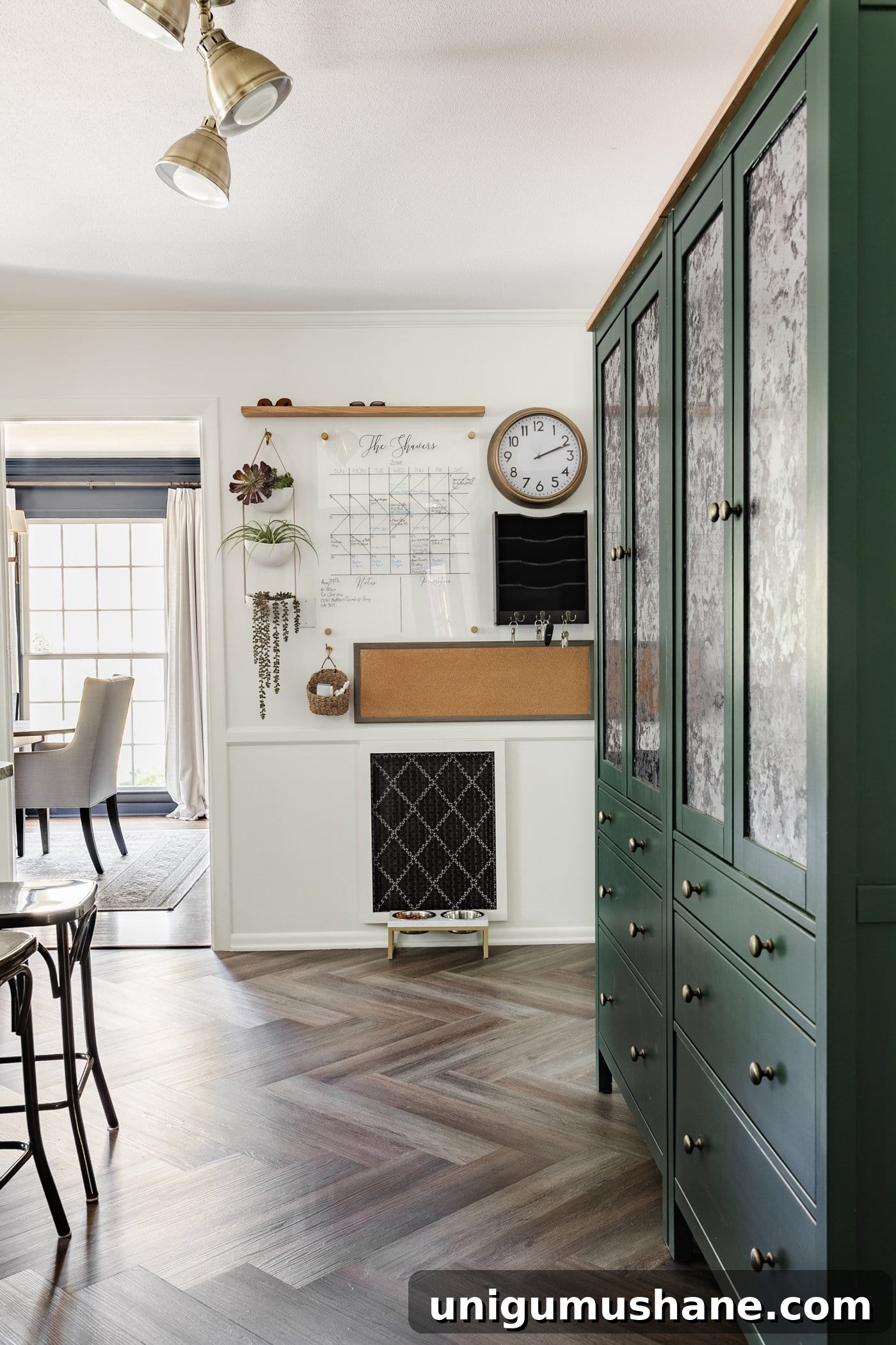 5-Year Home Transformation: Before and After Tour 17 family command center with calendar, memo board, and mail drop zone beside IKEA pantry cabinets