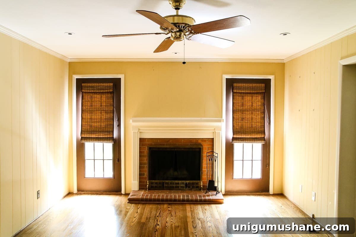 5-Year Home Transformation: Before and After Tour 25 yellow and white playroom before with brick fireplace
