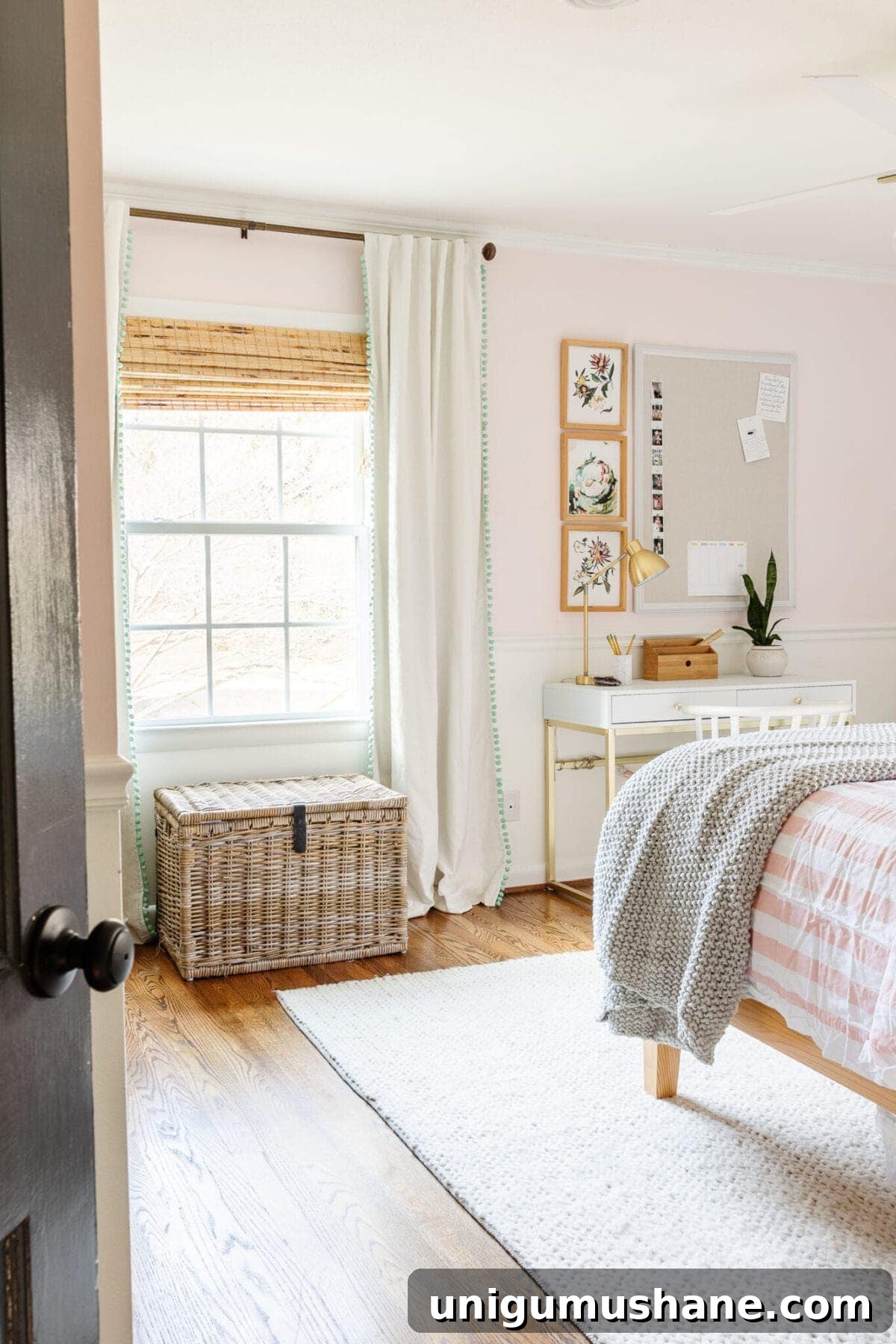 5-Year Home Transformation: Before and After Tour 32 blush pink girl's room with cream rug, white homework desk, rattan bed, and boho decor