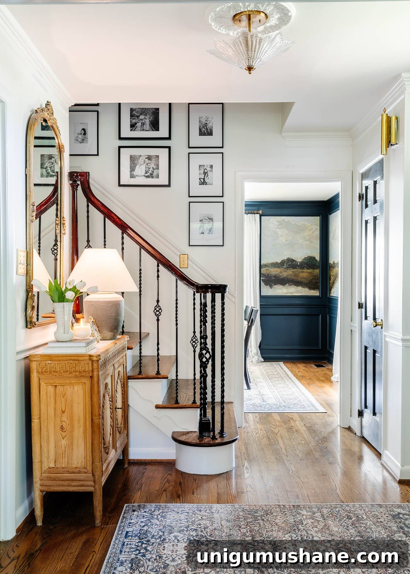 5-Year Home Transformation: Before and After Tour 7 before and after foyer front entryway with white walls, hardwood floors, and carved wood cabinet