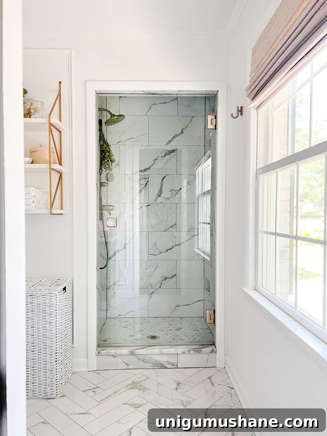 5-Year Home Transformation: Before and After Tour 42 white bathroom with marble shower and frameless glass shower door