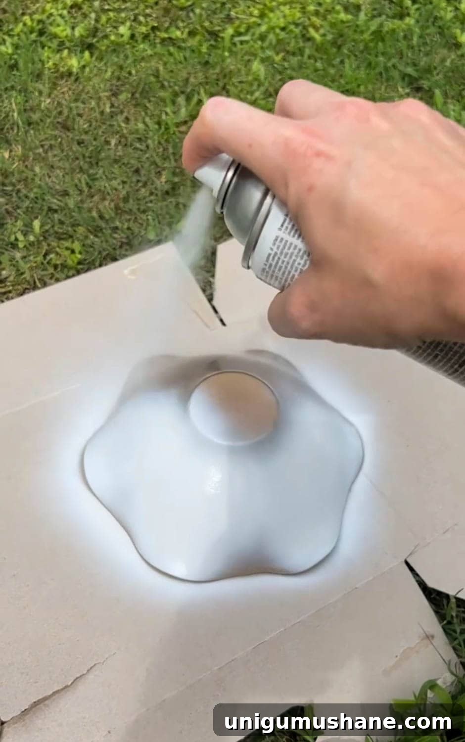 DIY Thrifted Scalloped Bowl Makeover with White Spray Paint 3 painting a scalloped bowl with white spray paint