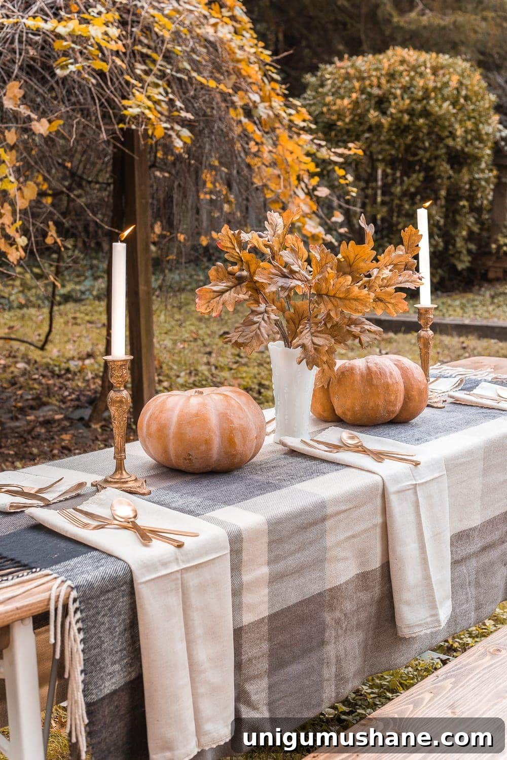DIY Fall Centerpiece Ideas Using Autumn Branches 14 fall branches in a milk glass vase on an outdoor dining table