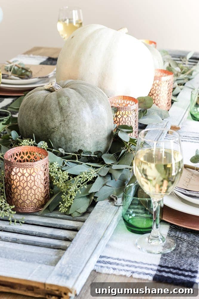 DIY Fall Centerpiece Ideas Using Autumn Branches 16 shutter table runner filled with pumpkins, eucalyptus, and copper candle holders