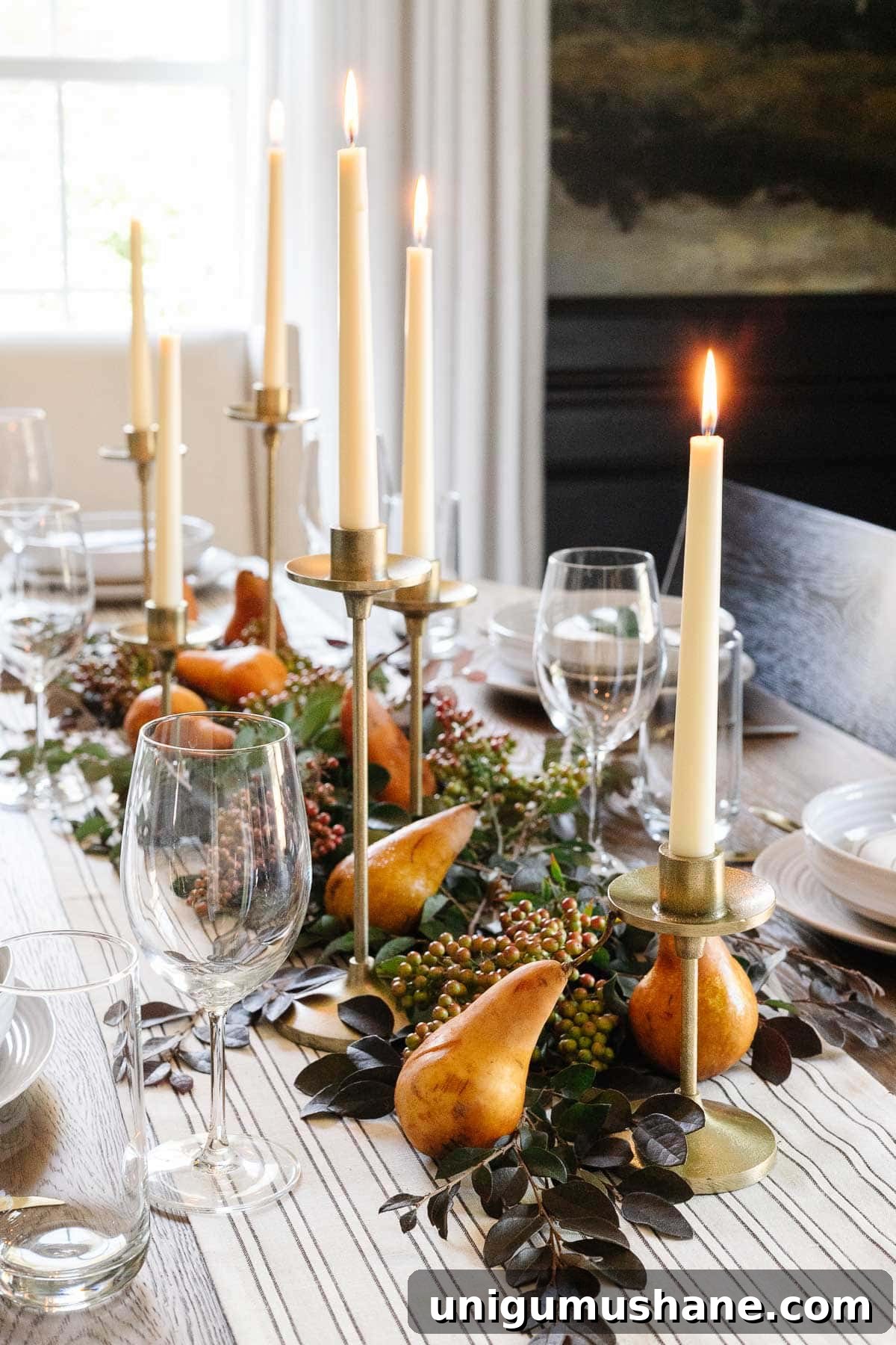 DIY Fall Centerpiece Ideas Using Autumn Branches 7 foraged fall centerpiece with cut leaves, berries, pears, and brass taper candles