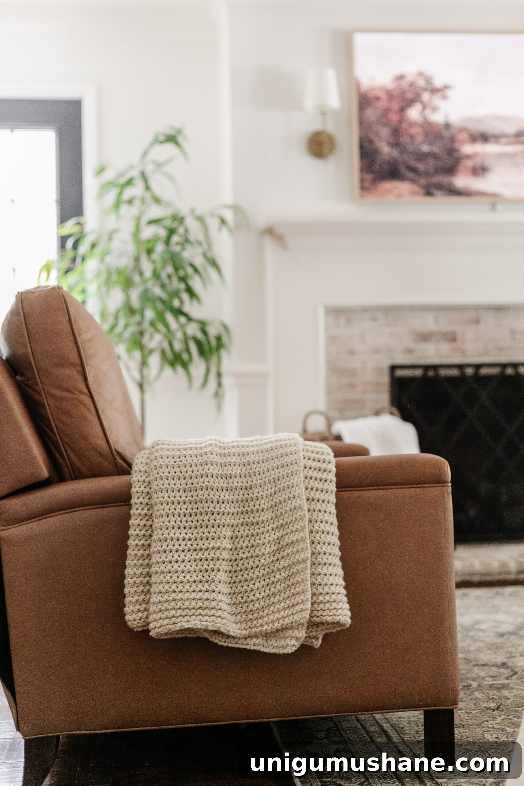 Budget Fall Living Room Decor Ideas That Save Time 18 leather recliner with knit throw blanket in a living room for fall decor