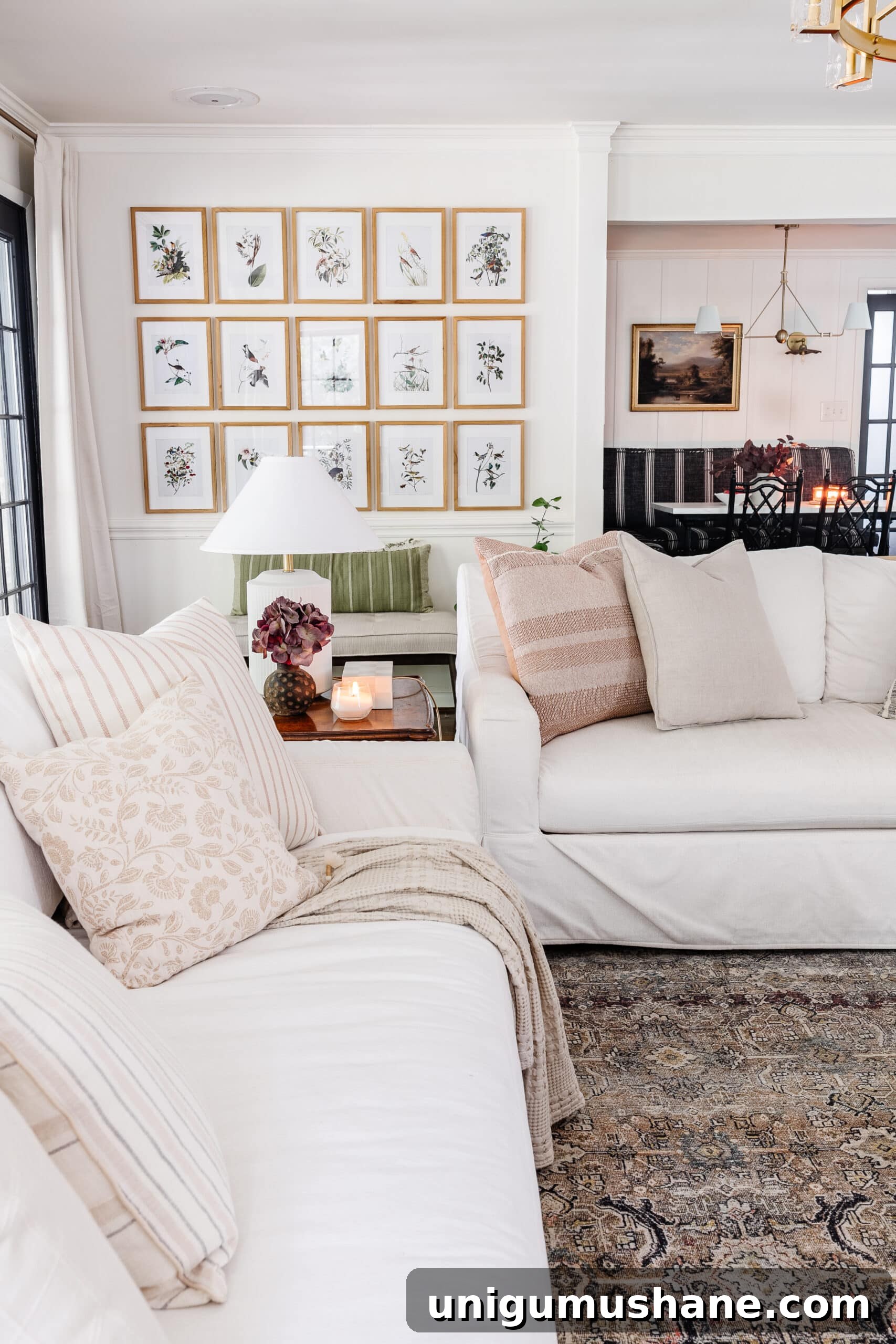 Budget Fall Living Room Decor Ideas That Save Time 23 fall decorating ideas for living room with white sofas, lamps, and picture frame gallery wall