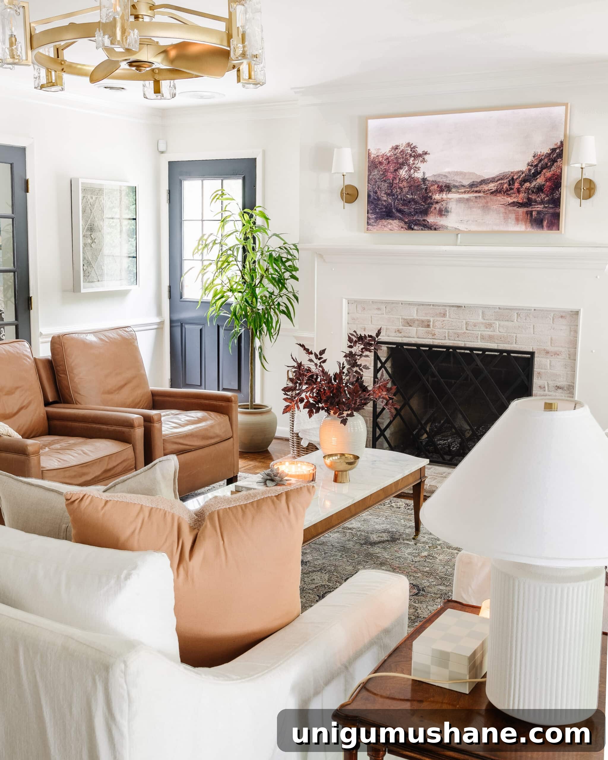 Budget Fall Living Room Decor Ideas That Save Time 24 fall decorating ideas for a living room with vase of fall stems, fall art on a TV, and leather recliners