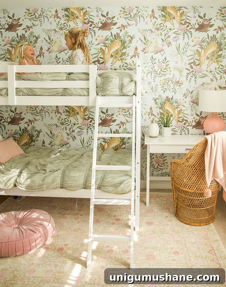 Space-Saving Bunk Bed Ideas for Small Bedrooms 12 woodland wallpaper in girls shared bedroom