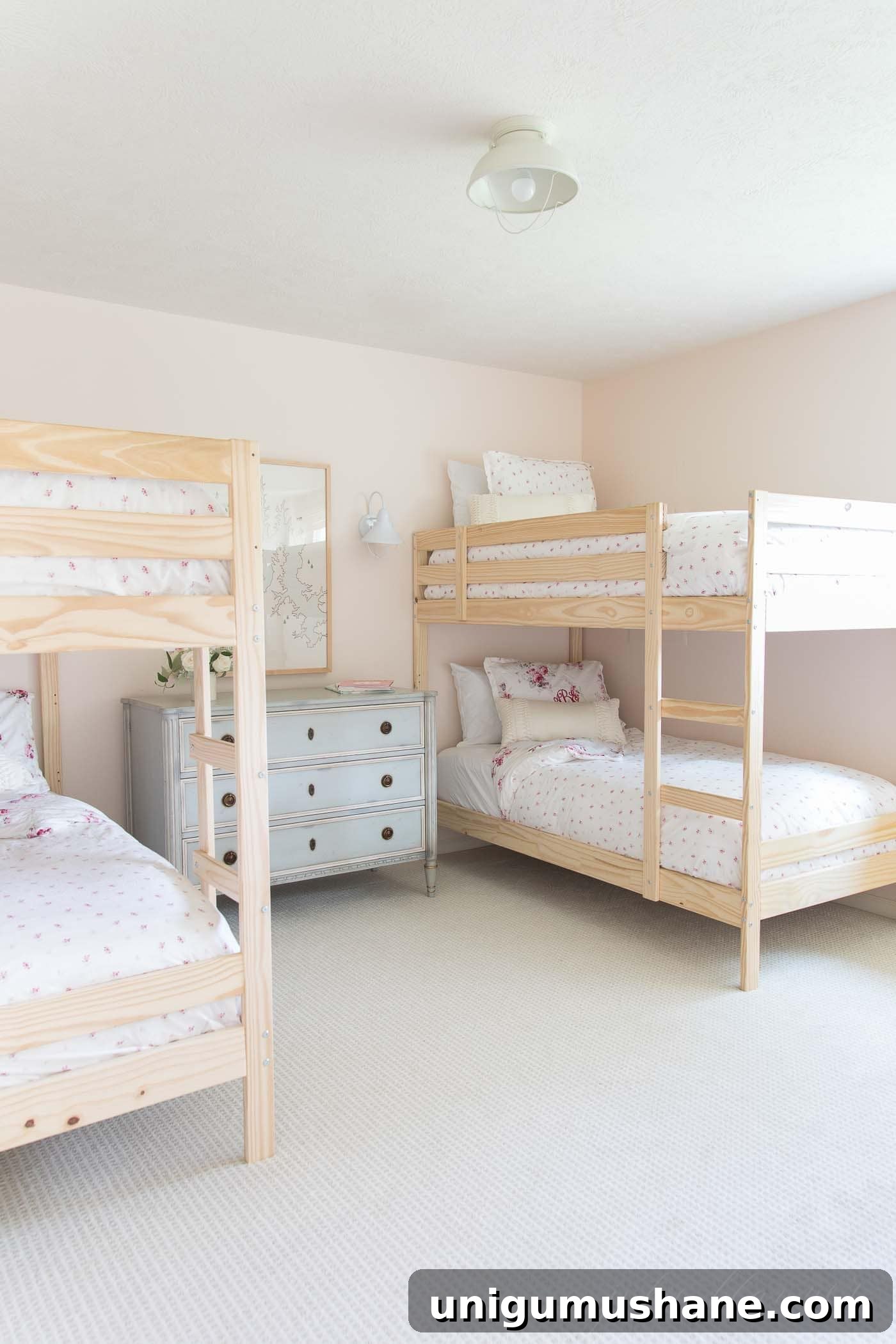 Space-Saving Bunk Bed Ideas for Small Bedrooms 17 blush pink shared bedroom for 4 people with 2 bunk beds