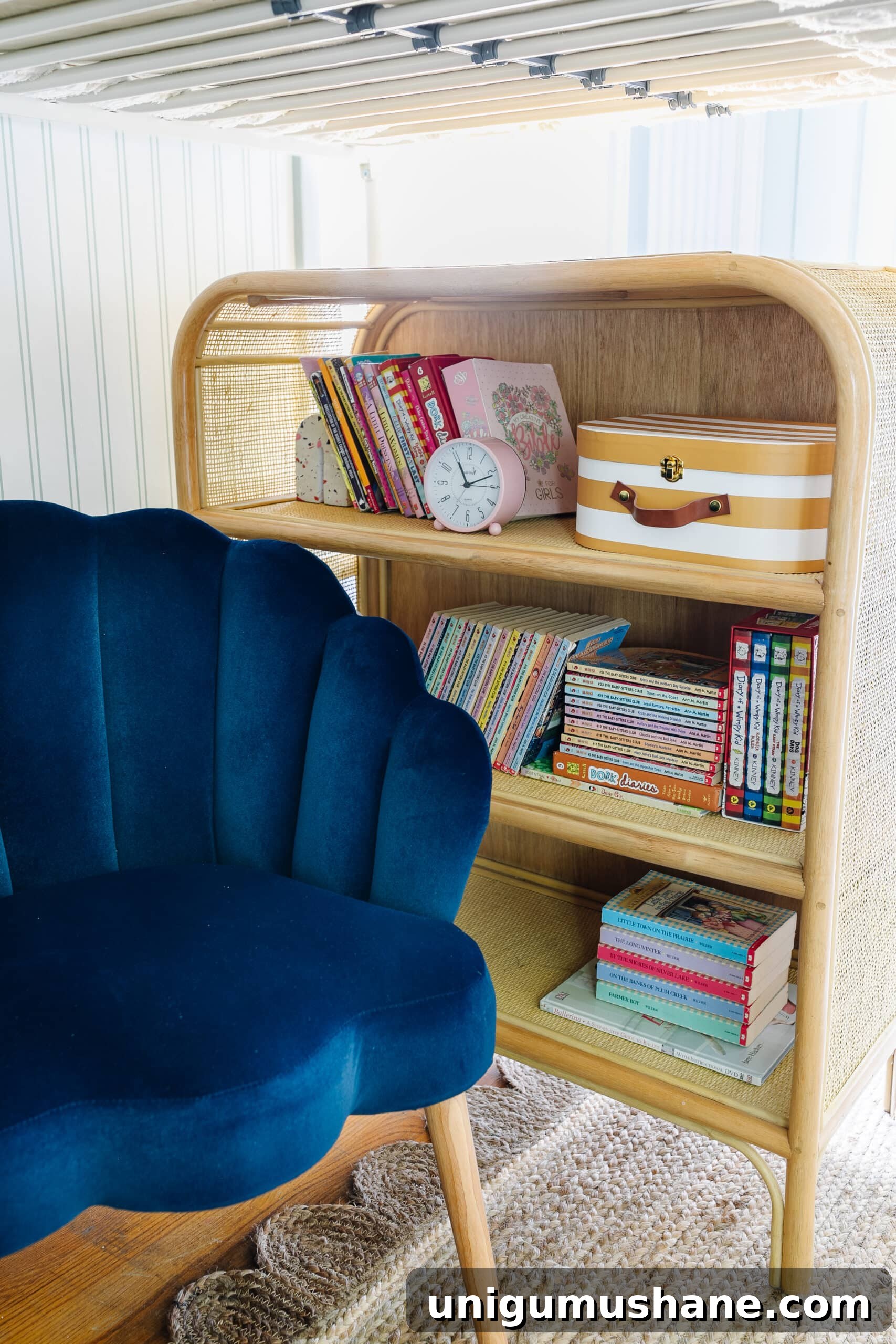 Beach-Themed Triple Bunk Bed Makeover for Teens 11 kids reading nook with chair and rattan bookshelf