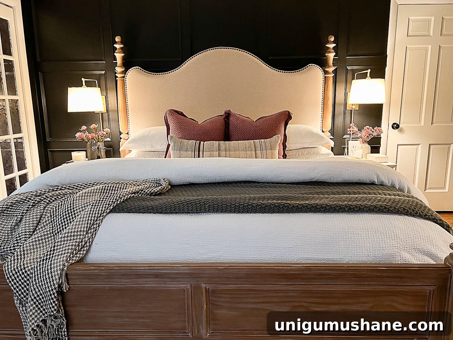 10 Affordable Cozy Bedroom Ideas to Improve Sleep 7 primary bedroom with cozy decor, luxurious bedding, and wall sconce bedside lamps