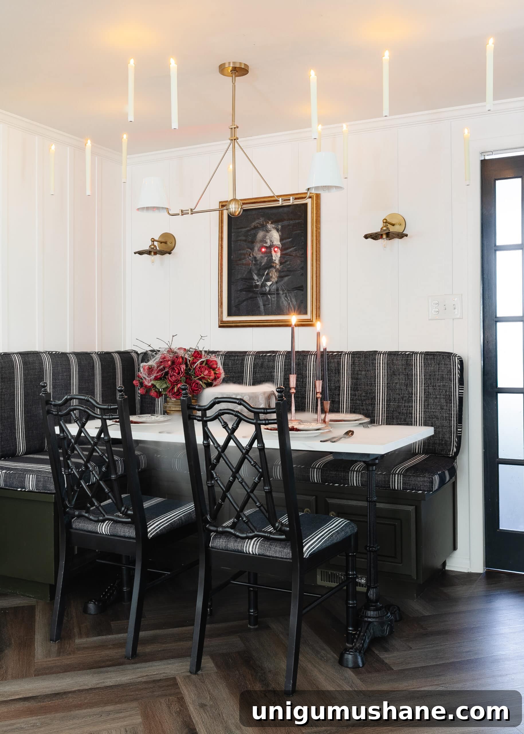 Murder Mystery Party Table Decor Ideas for Halloween 2 Halloween table decor ideas for a murder mystery dinner party with Halloween art portrait, floating candles, and dinnerware