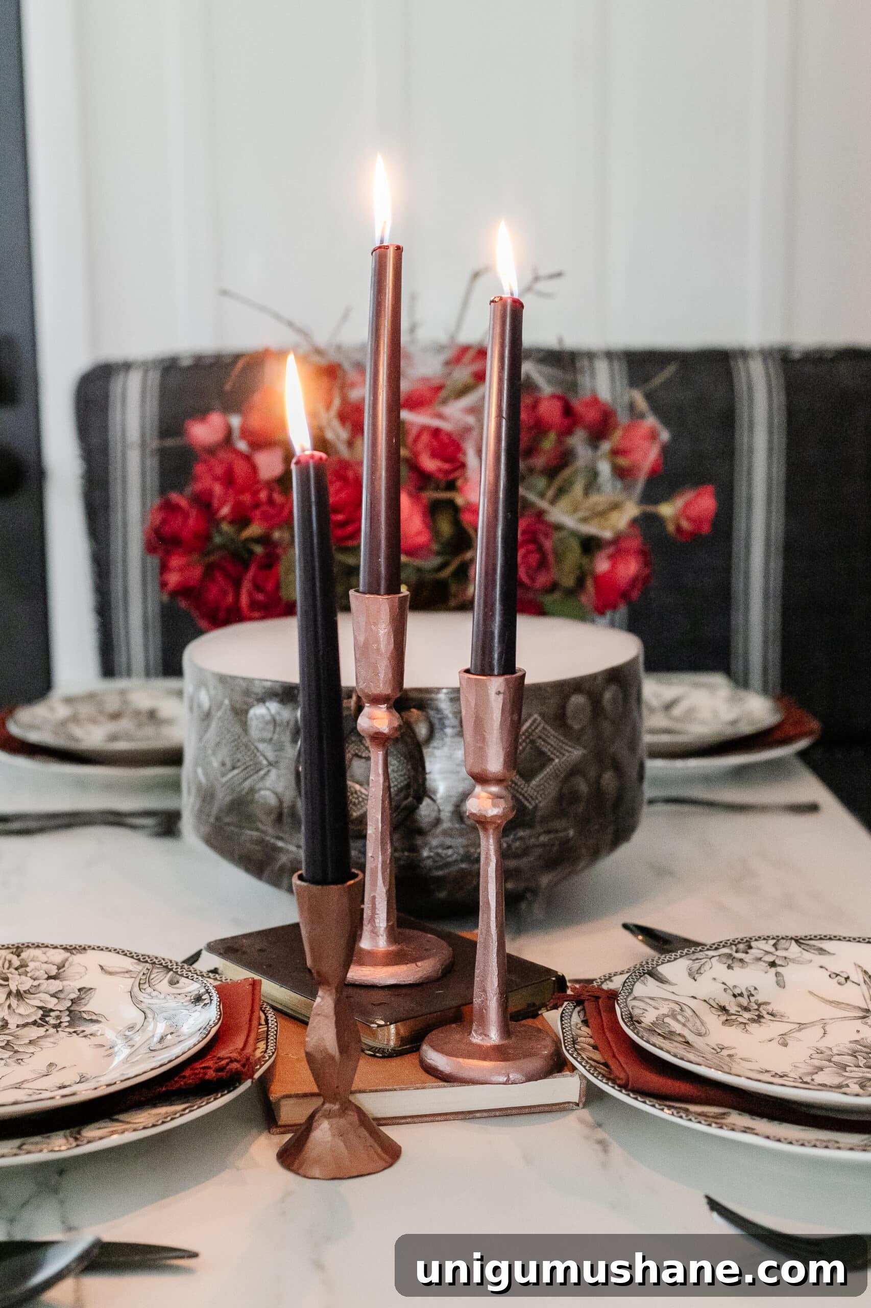 Murder Mystery Party Table Decor Ideas for Halloween 10 hammered copper candlesticks with black candles stacked on old books