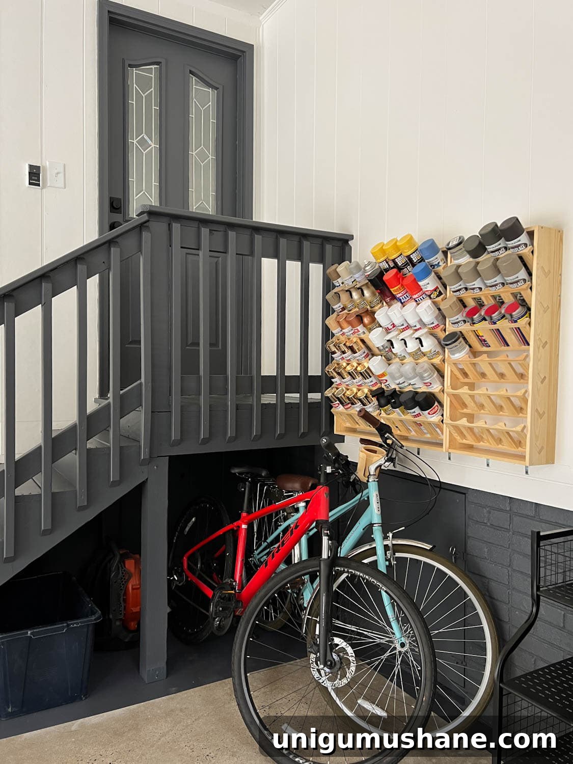 Smart Garage Storage Ideas to Maximize Space 13 paint can storage rack and bikes in a garage makeover