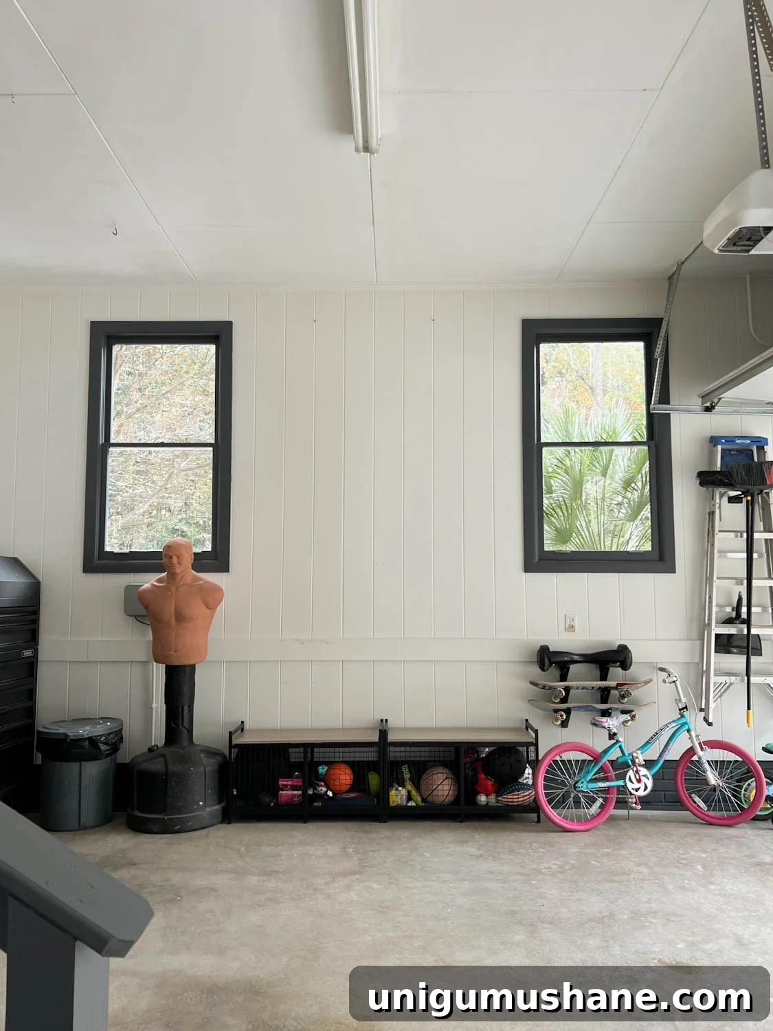 Smart Garage Storage Ideas to Maximize Space 6 garage makeover after with white walls and black trim