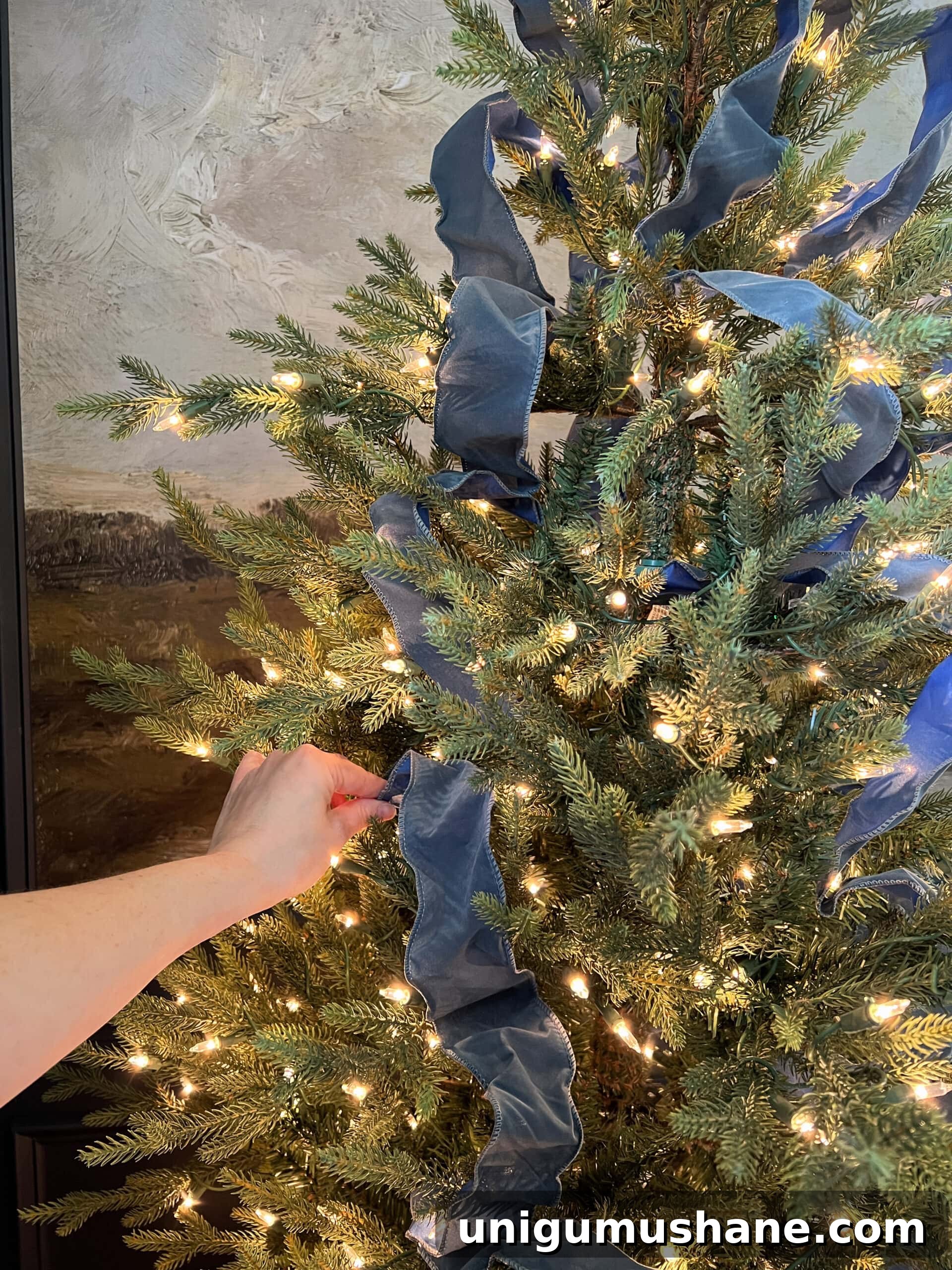 How to Add Ribbon Decorations to Your Christmas Tree 13 how to put on Christmas tree ribbon by tucking in pieces in a weaving pattern