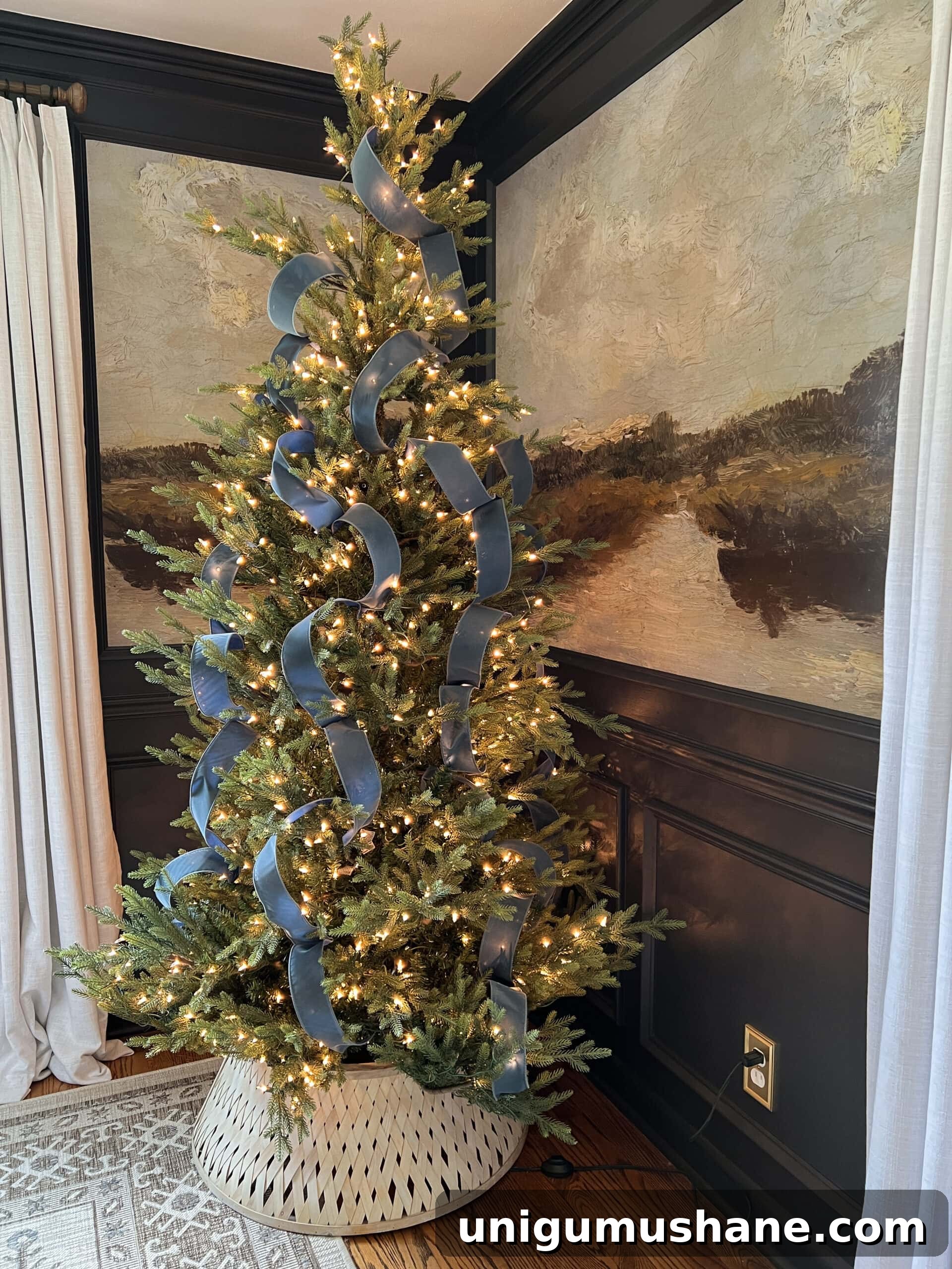 How to Add Ribbon Decorations to Your Christmas Tree 3 waterfall ribbon Christmas tree in antique blue