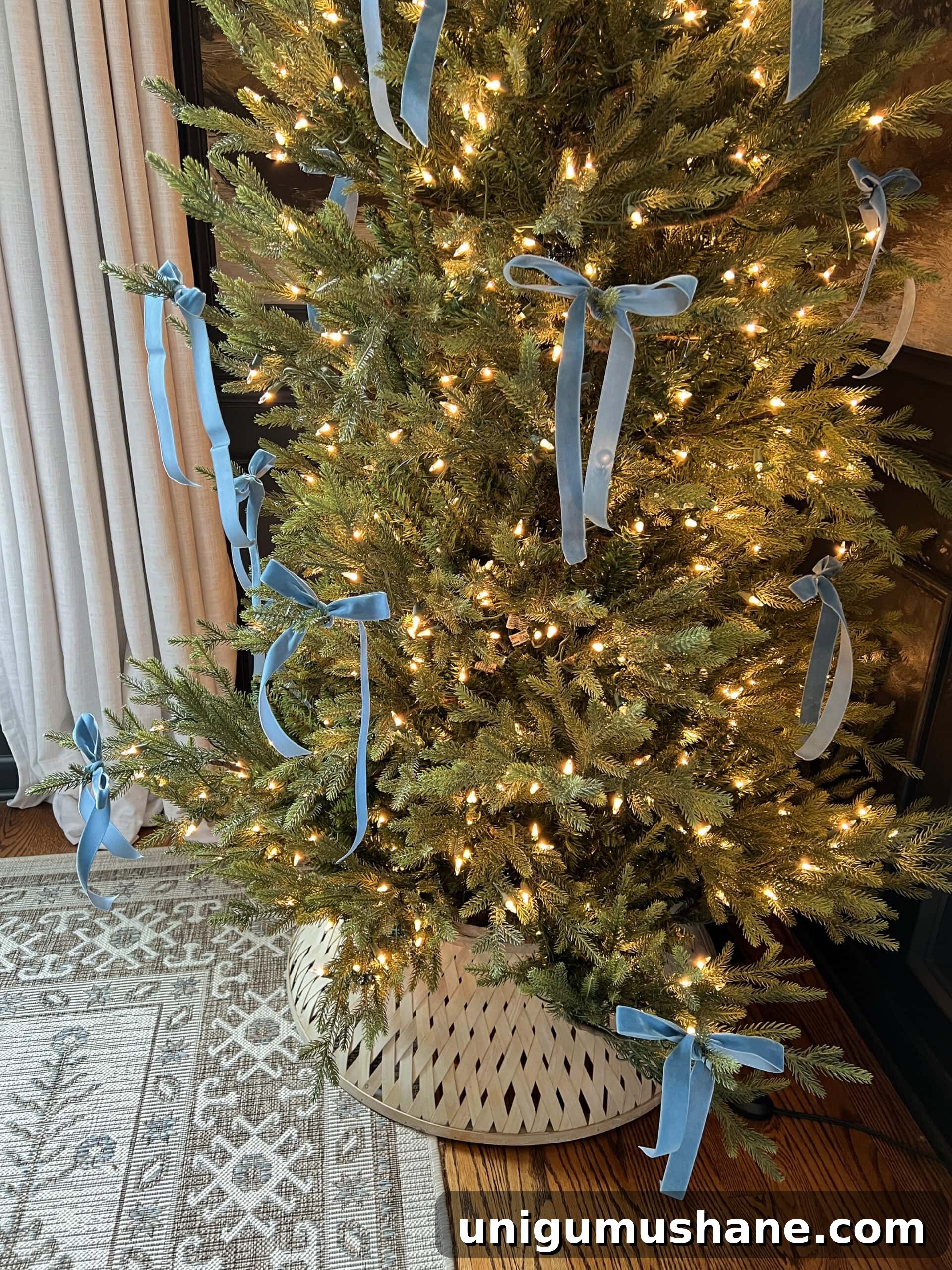 How to Add Ribbon Decorations to Your Christmas Tree 18 blue Christmas tree bows tied on branches