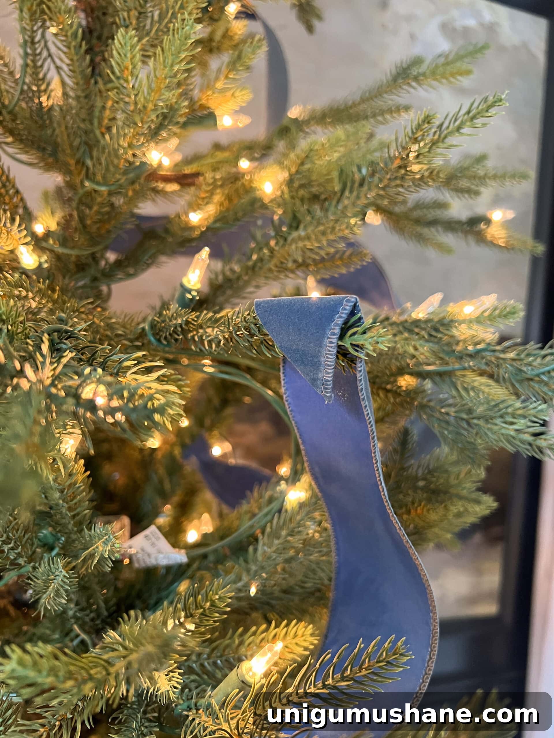 How to Add Ribbon Decorations to Your Christmas Tree 6 hook end of wired tree ribbon on the end of a branch as its starting point
