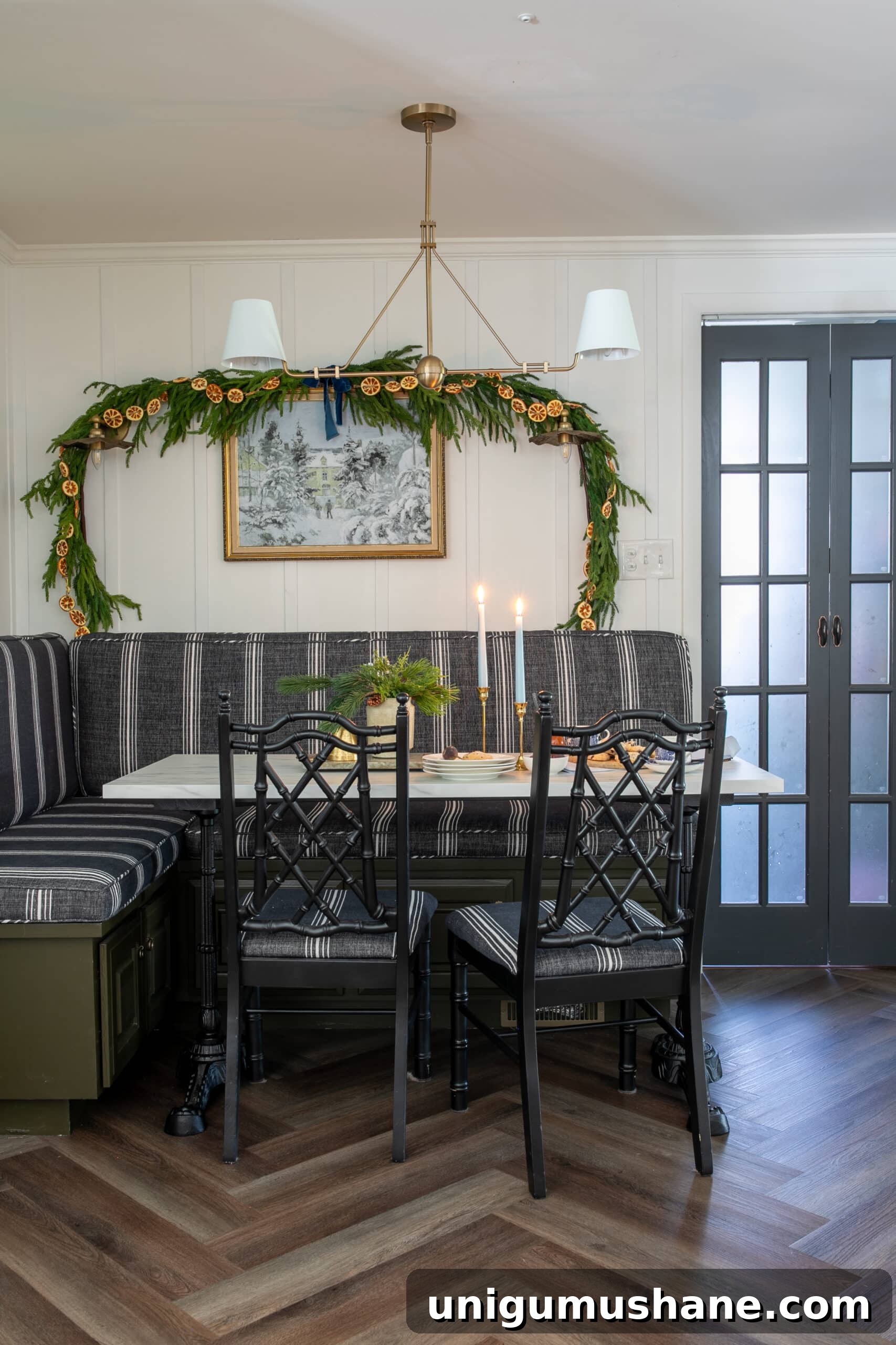 Free Winter Art Printable You Can Frame Anywhere 9 breakfast nook decorated for Christmas with garland and snow art on the wall