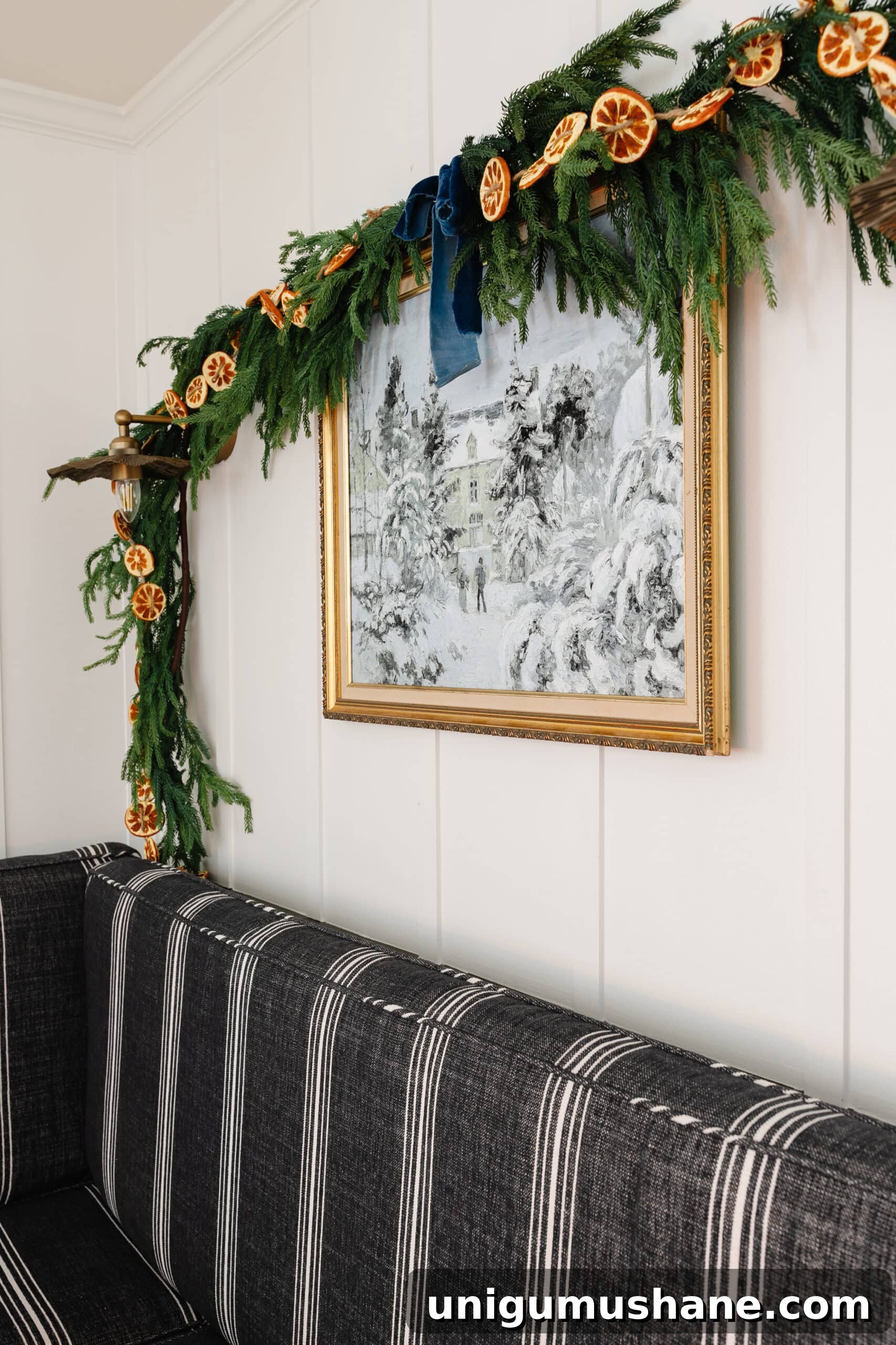 Free Winter Art Printable You Can Frame Anywhere 3 winter painting in gold thrifted frame with pine garland and orange slices