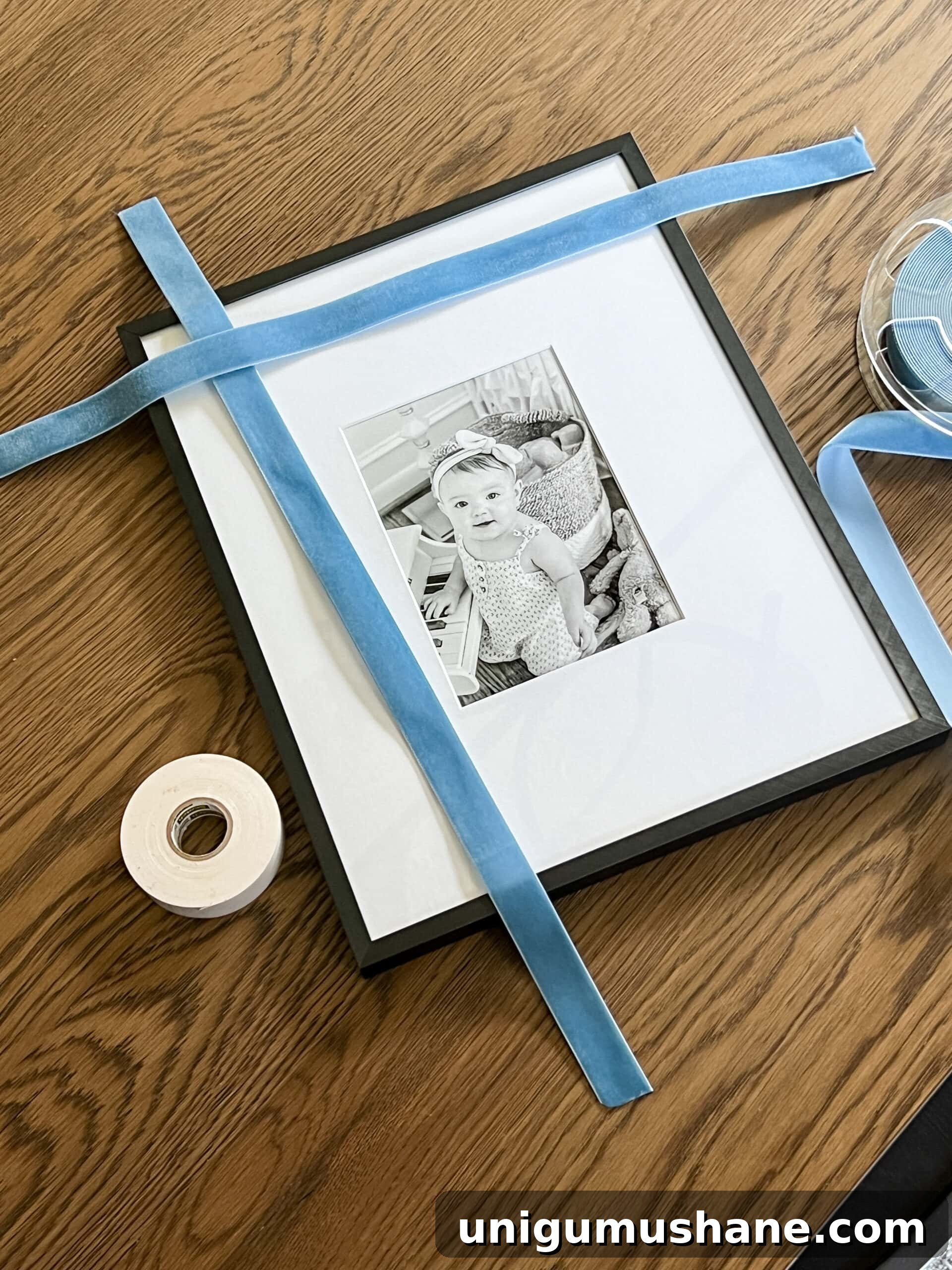 cutting ribbon to wrap around a picture frame