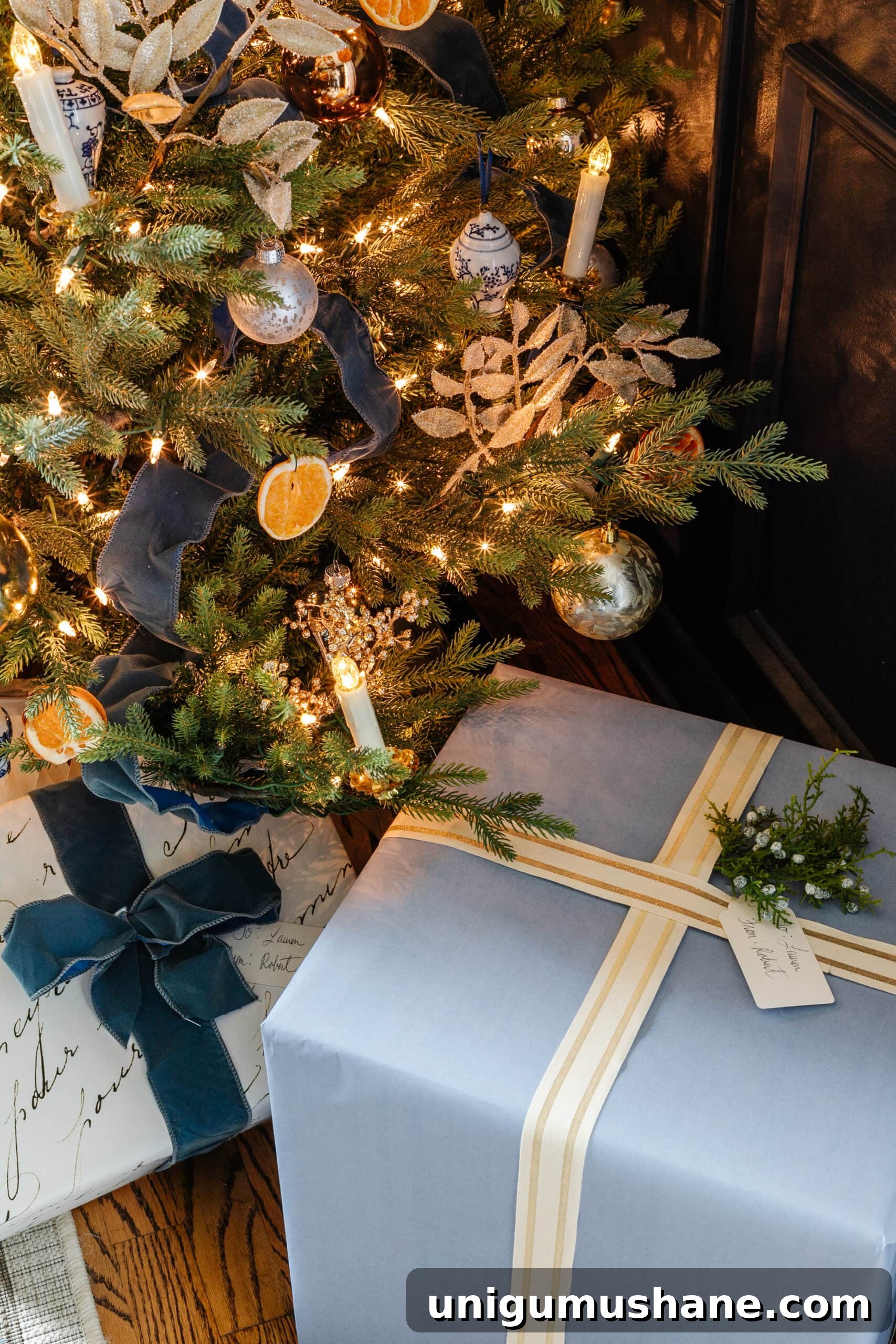 blue Christmas tree with blue gift wrap underneath