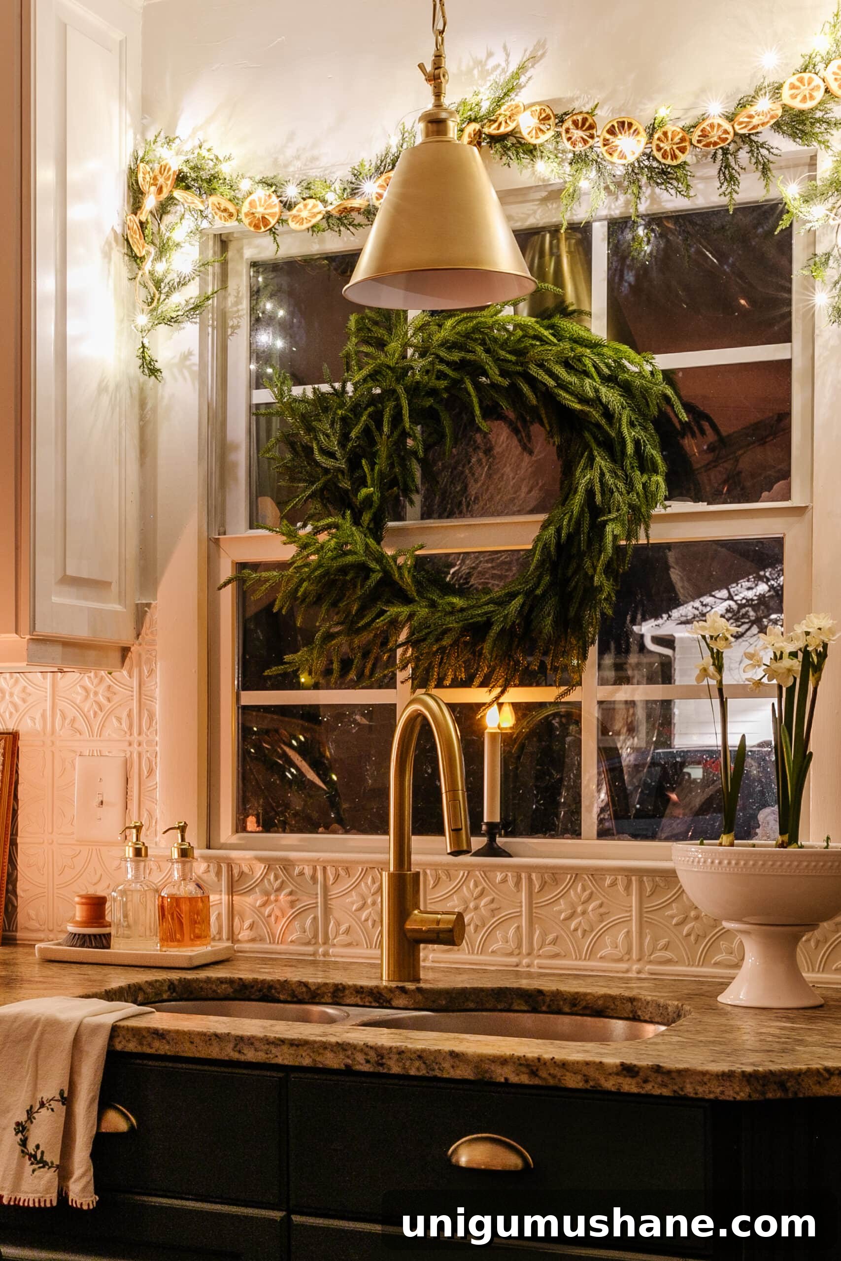 Top Battery-Powered Christmas Lights to Buy on Amazon 14 Christmas window candle on a kitchen sink window sill with wreath