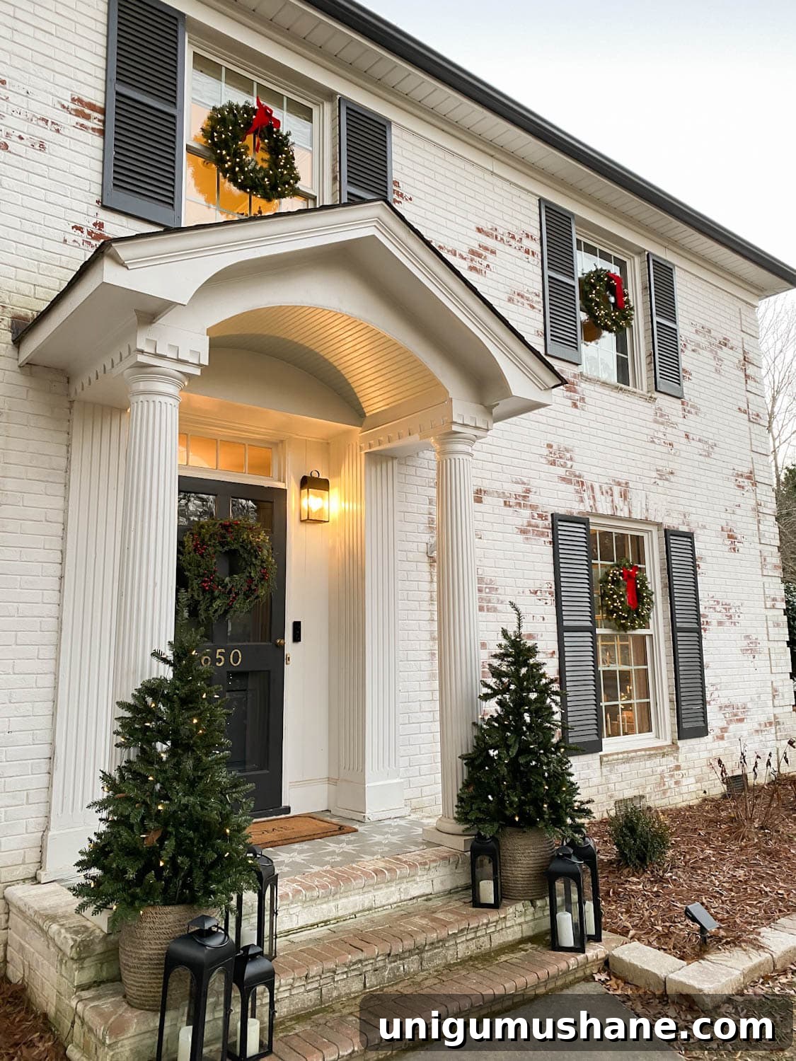 Top Battery-Powered Christmas Lights to Buy on Amazon 8 pre-lit Christmas wreaths on exterior windows of house